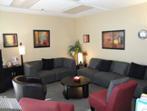 photo sherman oaks office suite 1101 meeting room, two grey sofas, two burgundy
 chairs