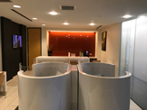 photo glendal office business lounge, light colored circular cubicles,
   burgandy wall covering