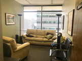 photo sherman oaks office suite 1208, two light colored sofas,
 large window